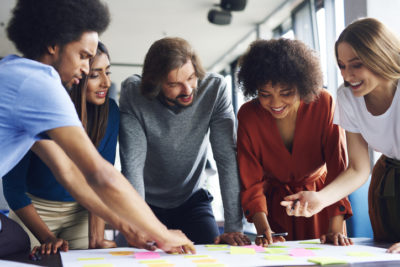 Creative business people planning with adhesive note